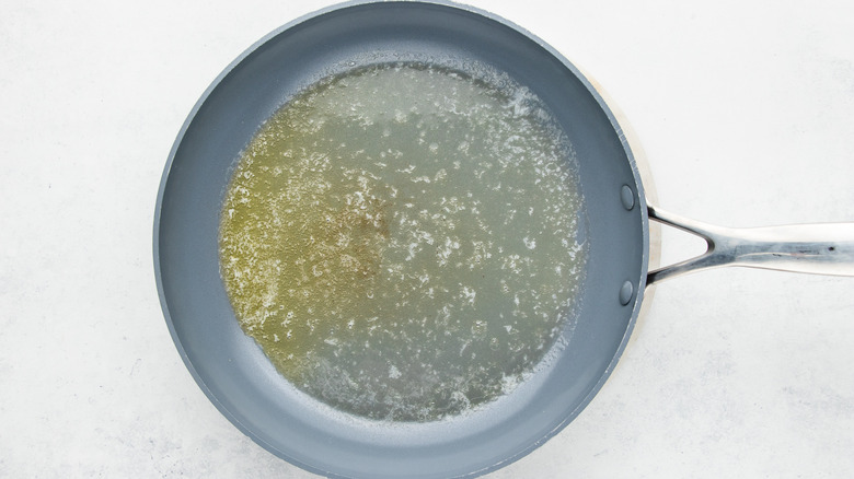 Butter melting in frying pan