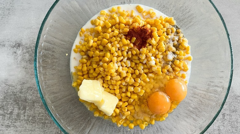 corn, eggs, and milk in a bowl