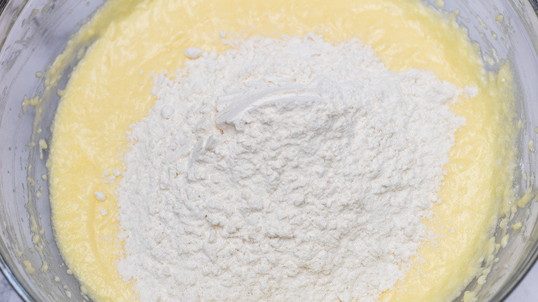 mixing flour into batter