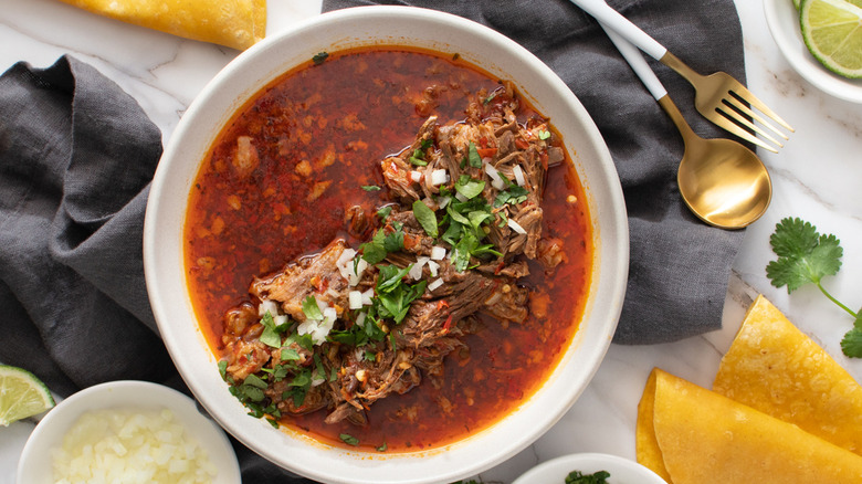 birria with cilantro and onions