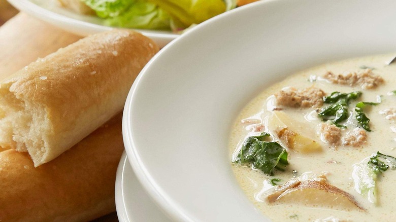 Close-up of Zuppa Toscana and a breadstick