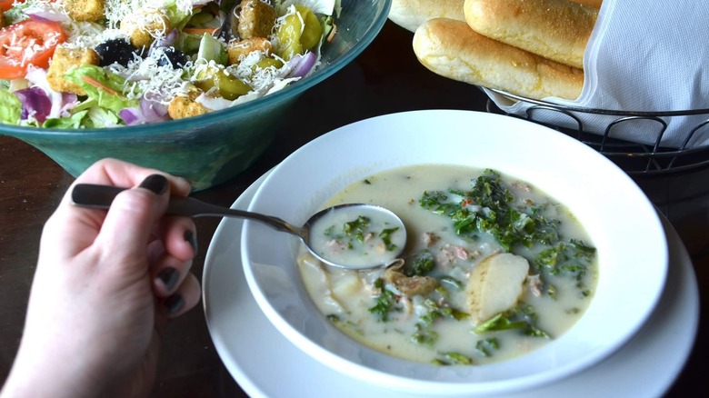 Zuppa Toscana soup with salad and breadsticks