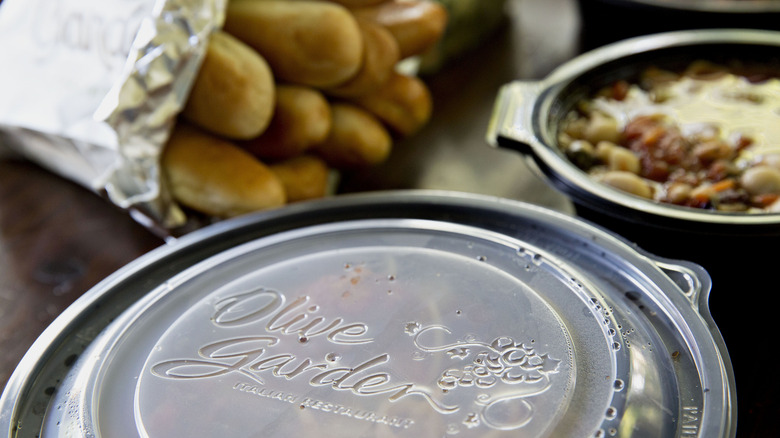 Olive Garden takeout containers and breadsticks