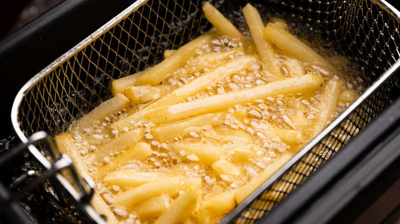 fries and oil in deep fryer