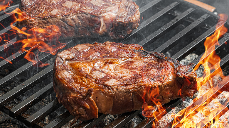 steak on charcoal grill