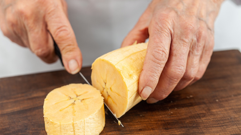 Person cutting plantains