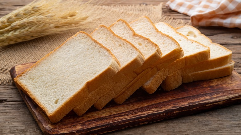 White bread slices on board