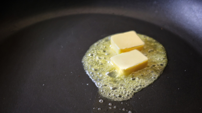 butter melting in skillet