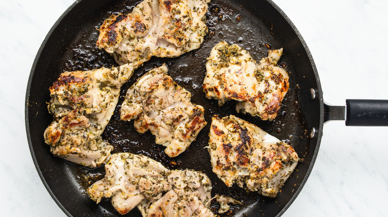 chicken thighs in frying pan