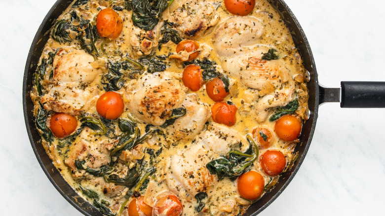 chicken and spinach in pan