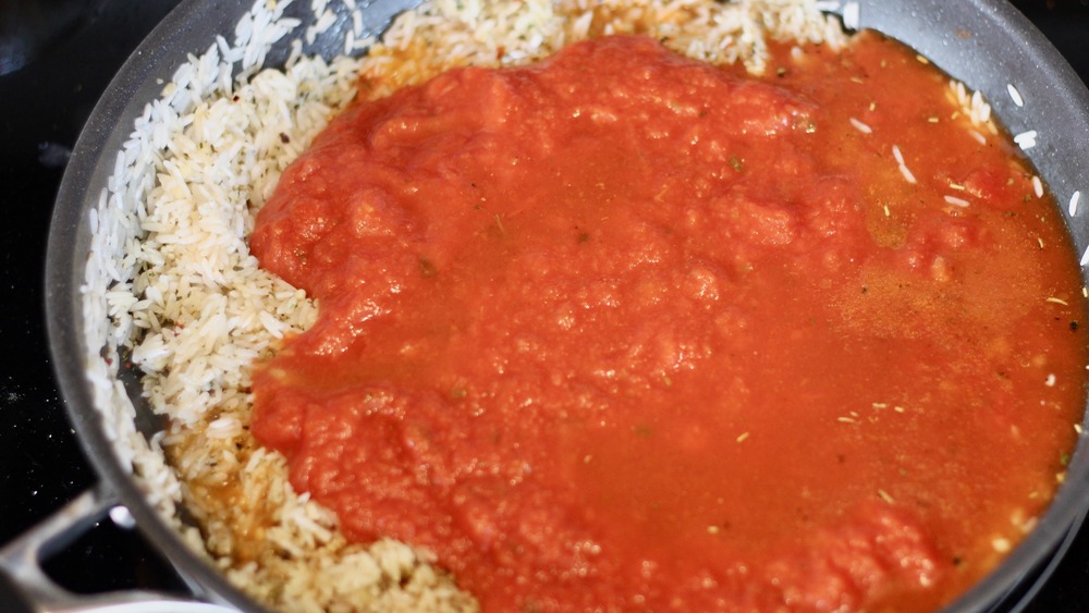 Rice and tomato sauce in a pan