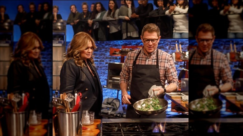 Bobby Flay cooking on "Beat Bobby Flay" with judge Valerie Bertinelli watching