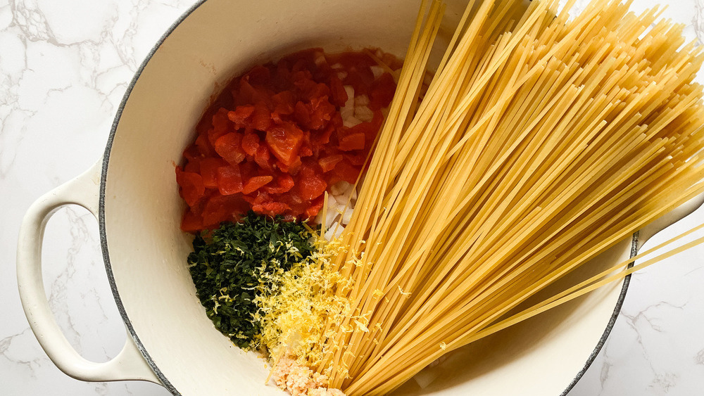 Bowl of raw noodles and vegetables