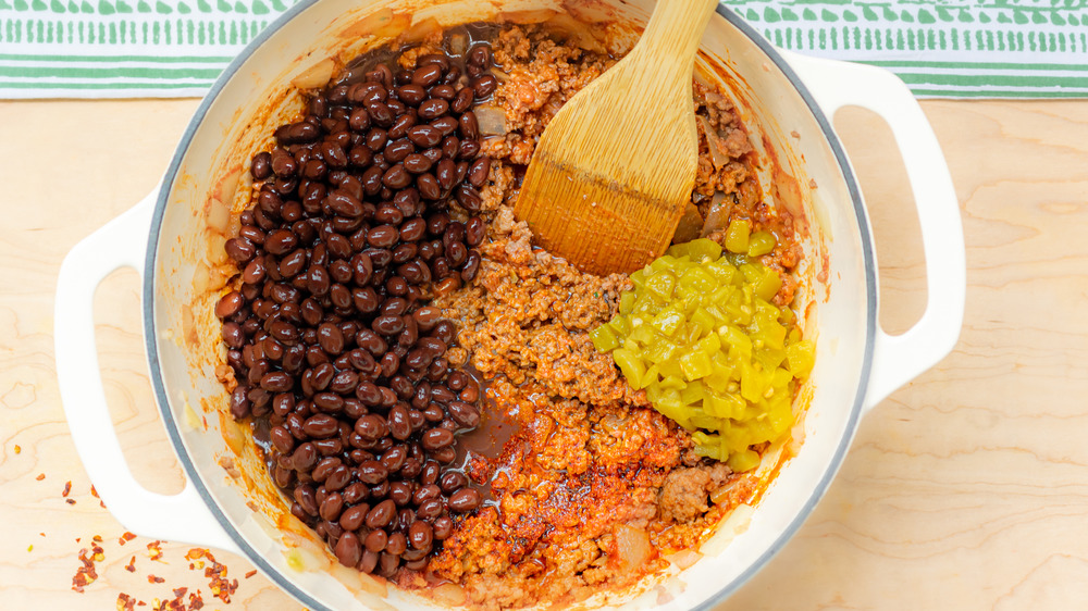 cooking black beans and chiles for one-pot stuffed bell peppers recipe