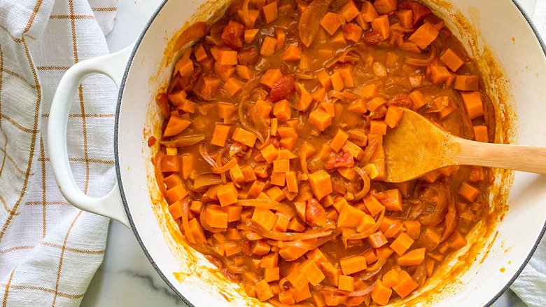 stirring sweet potato curry  
