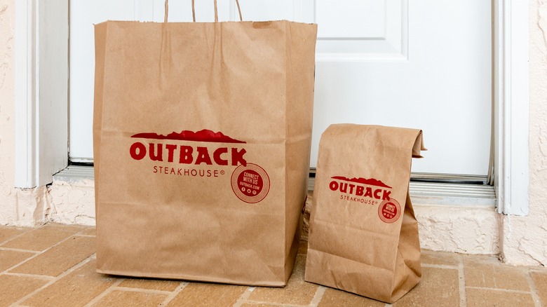 two Outback Steakhouse bags