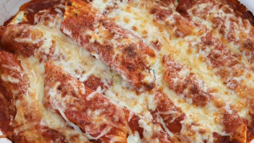 manicotti with sauce and cheese