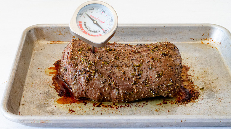 tenderloin on pan with thermometer