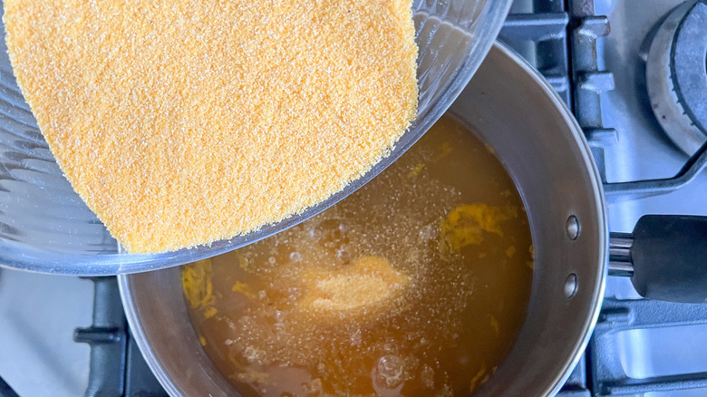 polenta pouring into pot