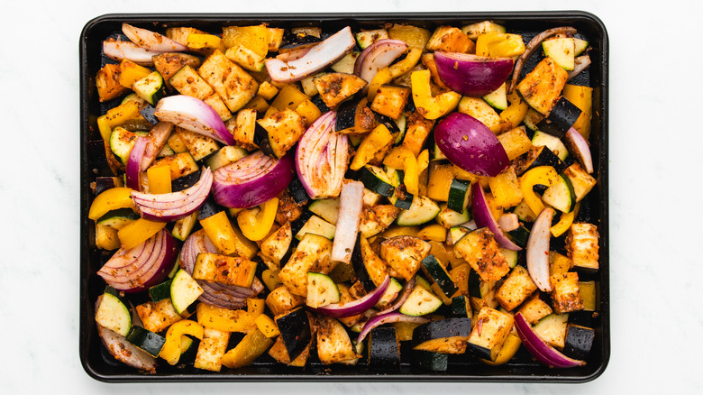 coated vegetables on baking sheet