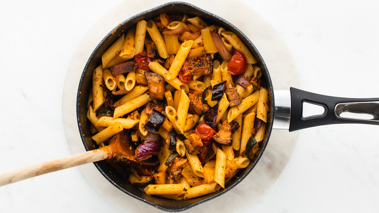 pasta and roasted veg in pan