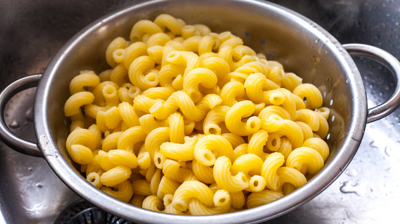 straining pasta in a colander