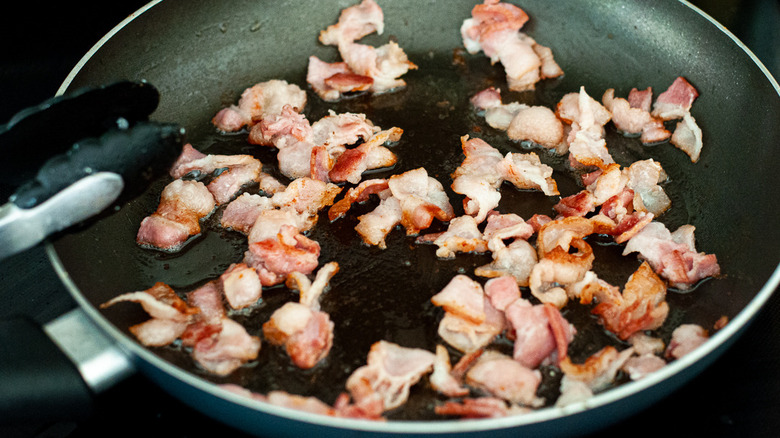 bacon frying in pan