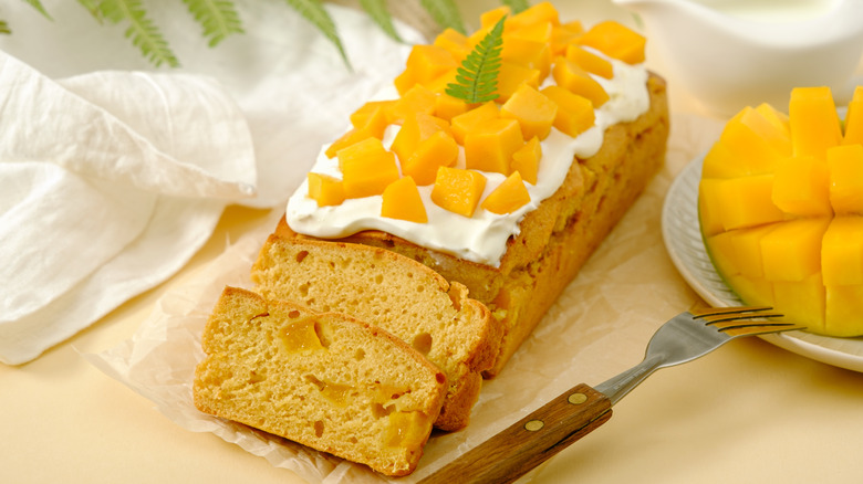 Mango cake with chopped mangoes on top