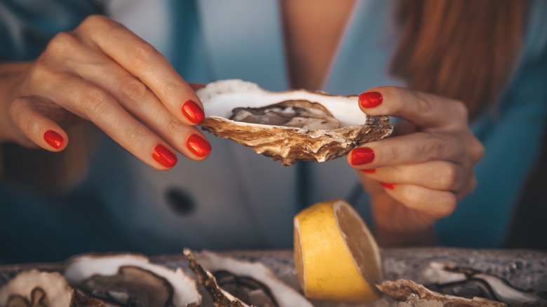 Hands holding oyster