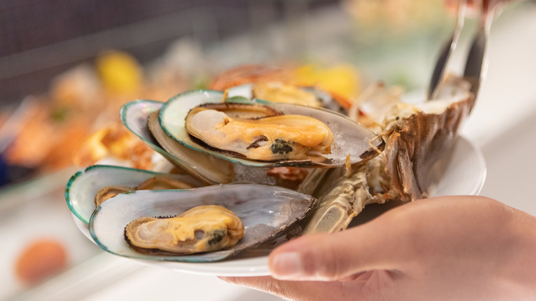 Hand preparing oyster