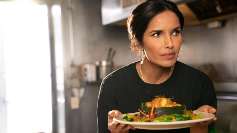 Padma Lakshmi holds plate of food