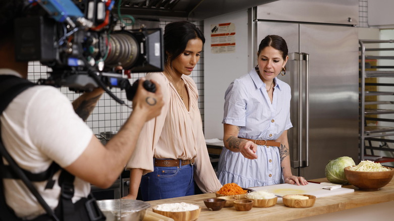 Padma Lakshmi and another woman in front of camera