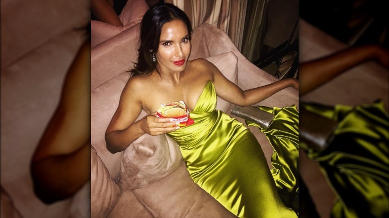 Padma Lakshmi eating a burger