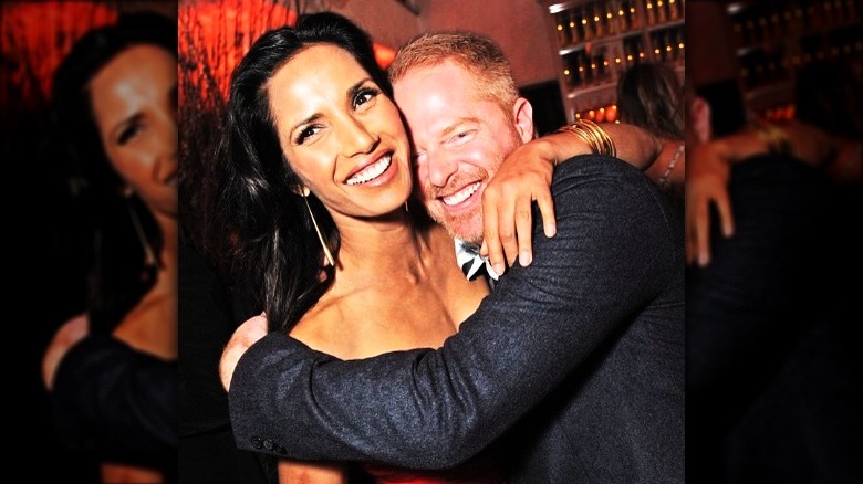 Jesse Tyler Ferguson embracing Padma Lakshmi