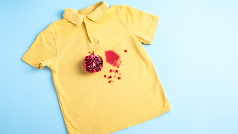 Pomegranate stained yellow polo shirt