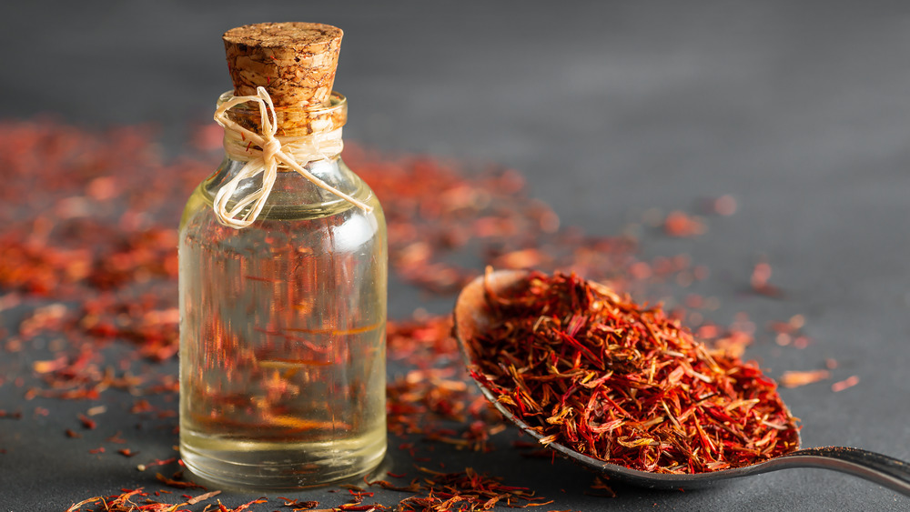 saffron in spoon and glass vial