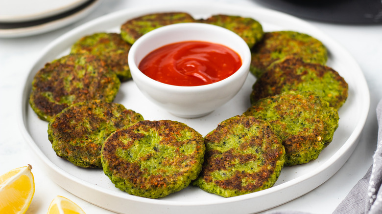 broccoli fritters on plate with ketchup