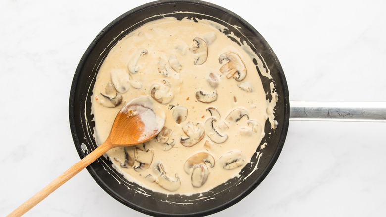 Creamy mushroom sauce in frying pan