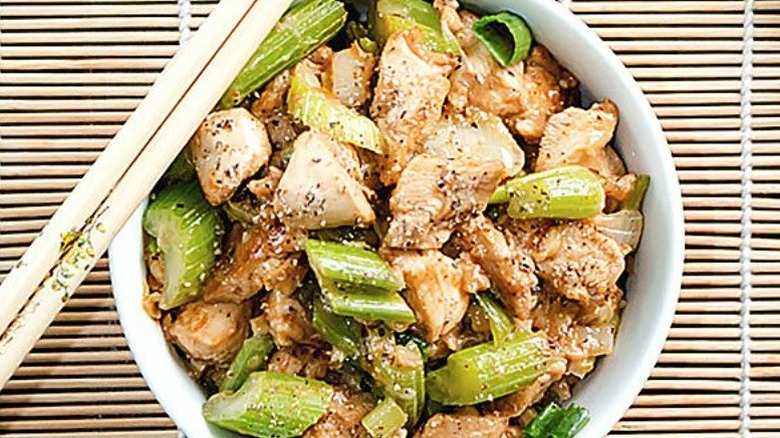 Black pepper chicken with chopsticks