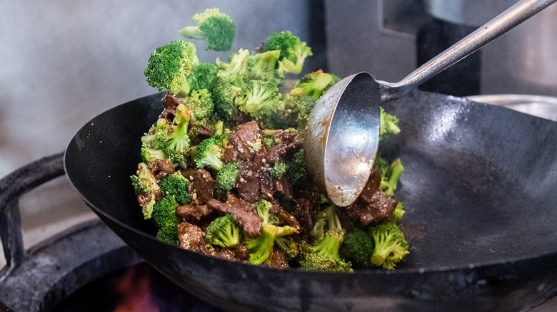 broccoli beef cooking on wok