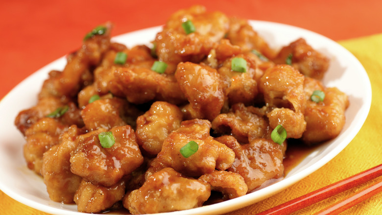 Orange chicken on colorful background