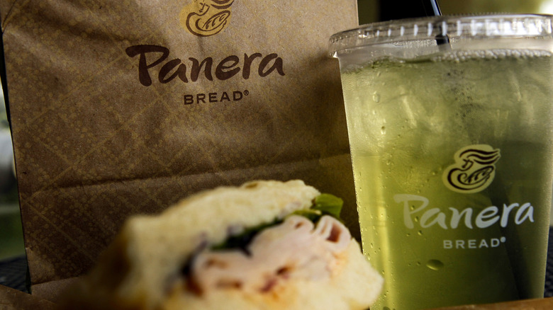 Panera bag with sandwich and tea