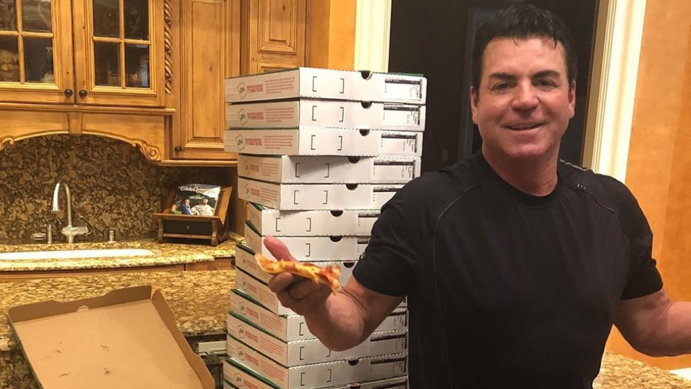 John Schnatter with Papa John's pizza