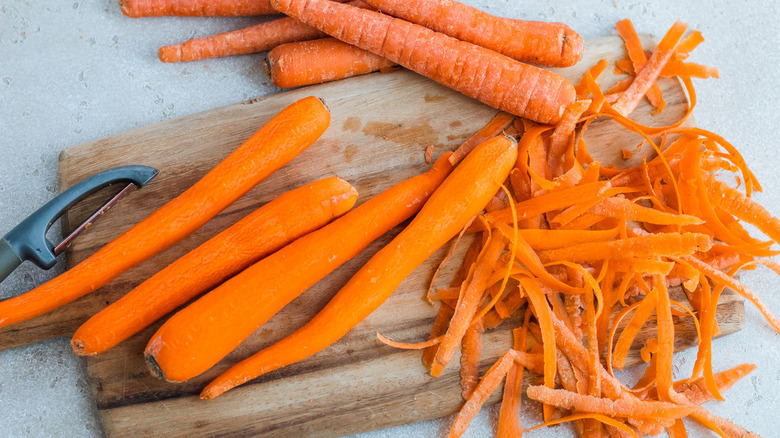 peeled carrots on cutting board