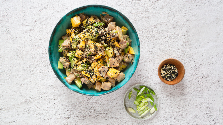 overhead view of tuna poke and toppings