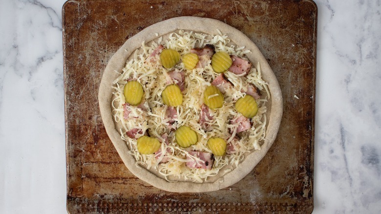 pastrami reuben pizza before baking