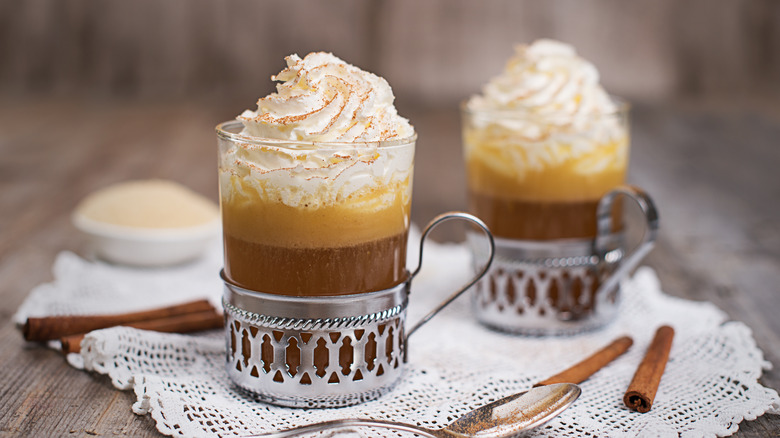 Hot buttered rum in silver cup holders