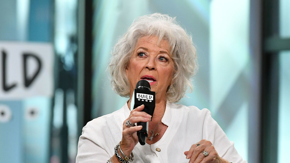 Paula Deen speaking into microphone