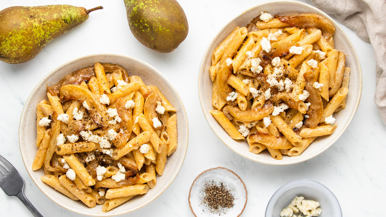 Two bowls of pear and gorgonzola pasta