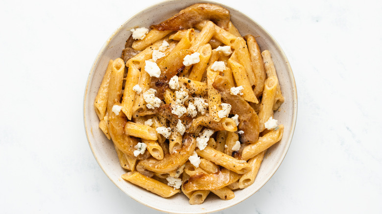 Pear and gorgonzola pasta in bowl